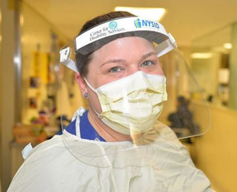 A women wearing personal protective equipment made by CFDS HII Tech